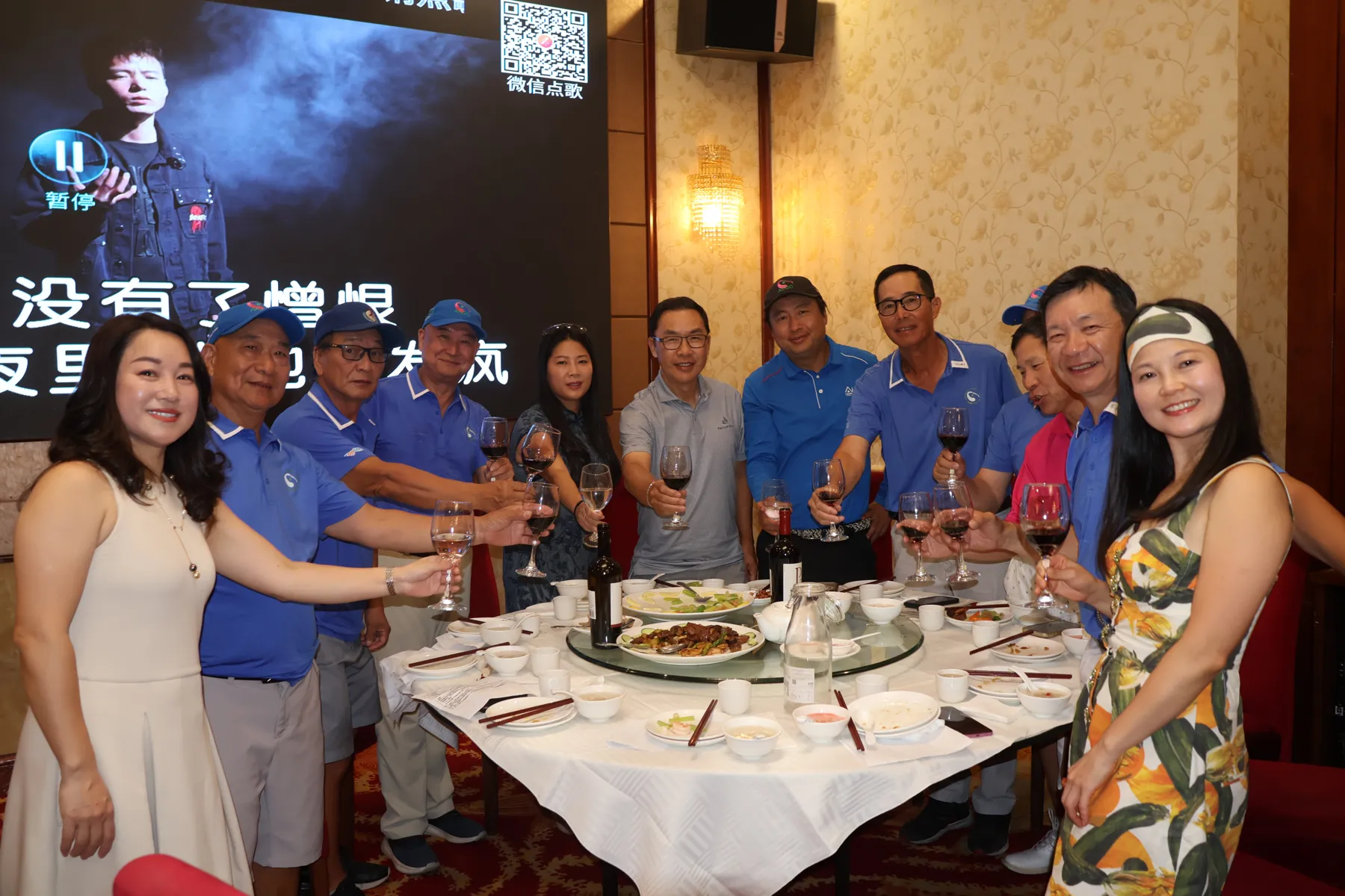 Members raising a glass around the table